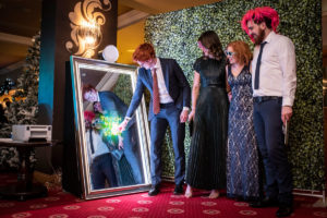 Wedding guest using touchscreen on Colorado Magic Mirror Photo Booth